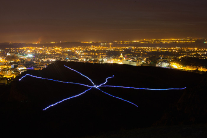 Endurance Runners And Walkers Create The Speed Of Light On Arthur's Seat As Part Of The Edinburgh Festival